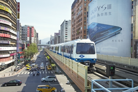 Taipei City, Taiwan, 2012, July,12th :  Taipei Metro Brown Line Train approaches Stationのeditorial素材