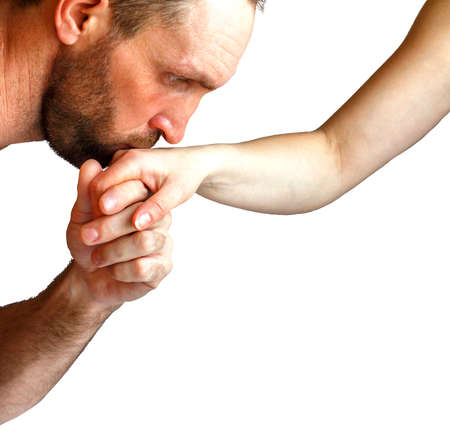 Man kissing womans hand.