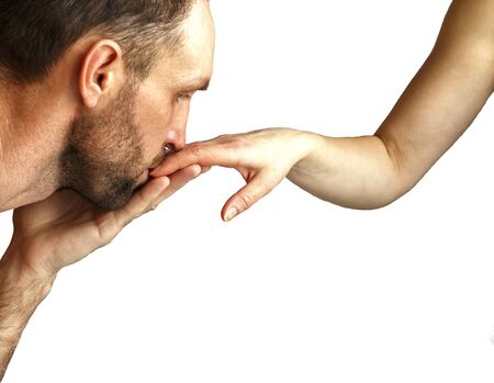 Man kissing woman's hand. Isolated on white.の写真素材