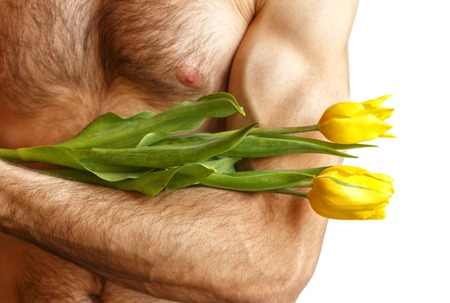 A man holding tulips. Isolated on whiteの写真素材