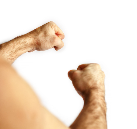 Fists of a man. Isolated on whiteの写真素材