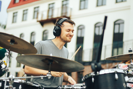 MINSK, BELARUS.JULY 29 2017 A street muscian playing drumsのeditorial素材
