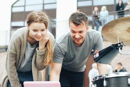 MINSK, BELARUS.JULY 29 2017 Three Interested People Watching News on Tabletのeditorial素材
