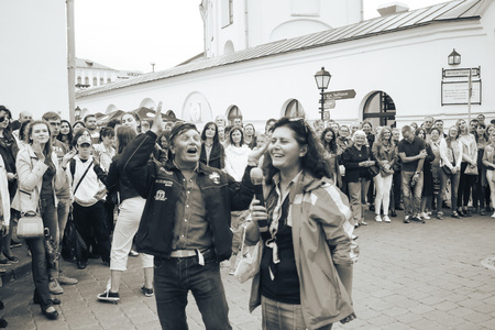 MINSK, BELARUS.JULY 29, 2017. Woman with a microphone sings on the street