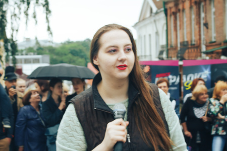 MINSK, BELARUS.JULY 29, 2017. Woman with a microphone sings on the streetのeditorial素材