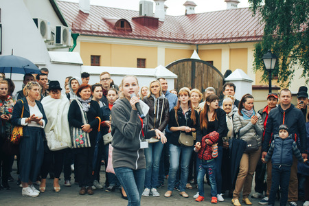 MINSK, BELARUS.JULY 29, 2017. Woman with a microphone sings on the streetのeditorial素材