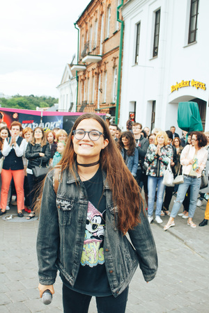 MINSK, BELARUS.JULY 29, 2017. Woman with a microphone sings on the streetのeditorial素材