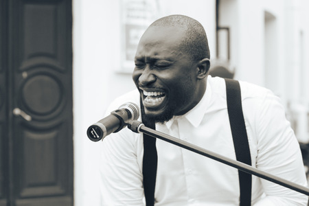 MINSK, BELARUS.JULY 29 2017 Black man about microphone