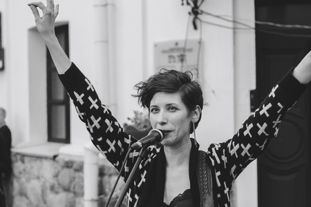 MINSK, BELARUS.JULY 29, 2017. Woman with a microphone sings on the streetのeditorial素材