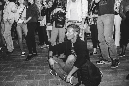 MINSK, BELARUS.JULY 29, 2017. Afro man sings and dances at night on the streetのeditorial素材