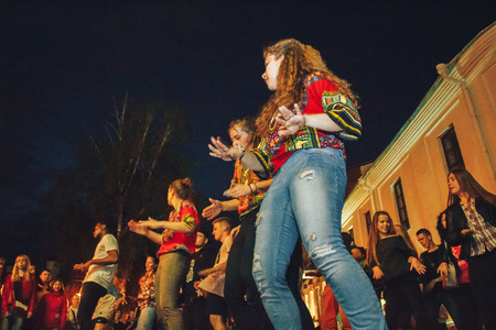 MINSK, BELARUS.JULY 29, 2017. Afro man sings and dances at night on the street