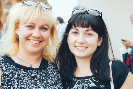 MINSK, BELARUS.JULY 29, 2017 Two girlfriends are smiling on the streetのeditorial素材