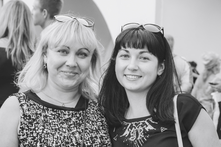 MINSK, BELARUS.JULY 29, 2017 Two girlfriends are smiling on the streetのeditorial素材