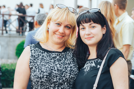 MINSK, BELARUS.JULY 29, 2017 Two girlfriends are smiling on the streetのeditorial素材