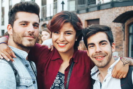 MINSK, BELARUS.August 5, 2017. Two guys and a girl are posing in front of the cameraのeditorial素材
