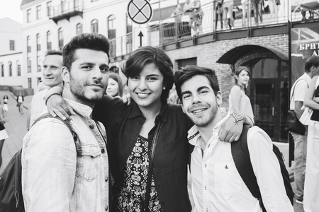 MINSK, BELARUS.August 5, 2017. Two guys and a girl are posing in front of the cameraのeditorial素材