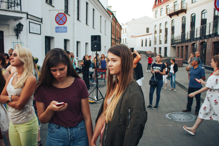 MINSK, BELARUS.August 5, 2017. Man takes people to the phone on the streetのeditorial素材