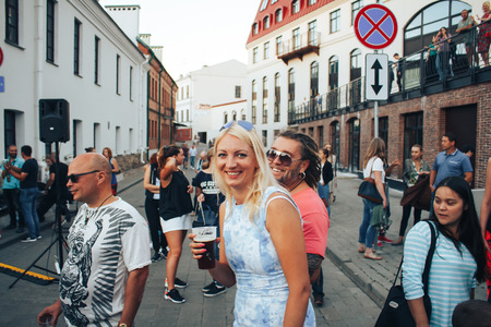 MINSK, BELARUS.August 5, 2017. Man takes people to the phone on the streetのeditorial素材