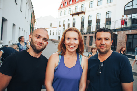 MINSK, BELARUS.August 5, 2017. Two guys and a girl are posing in front of the cameraのeditorial素材