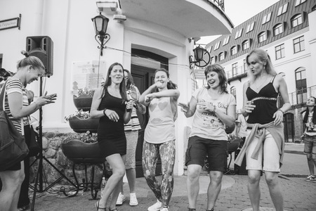 MINSK, BELARUS.JULY 29, 2017. Group of people laughing and posing in front of cameraのeditorial素材