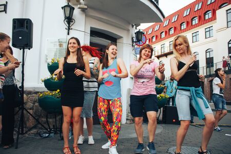 MINSK, BELARUS.JULY 29, 2017. Group of people laughing and posing in front of cameraのeditorial素材