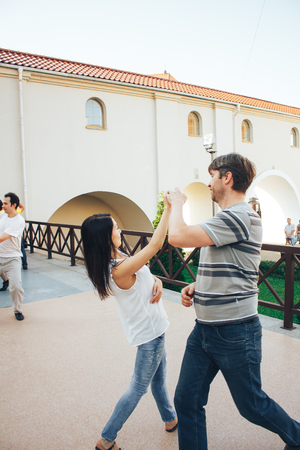 MINSK, BELARUS.August 12, 2017 Couples dancing outdoors on the streetのeditorial素材
