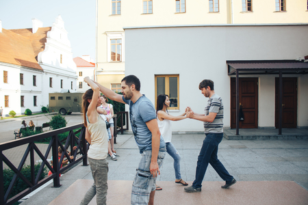 MINSK, BELARUS.August 12, 2017 Couples dancing outdoors on the streetのeditorial素材