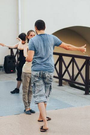 MINSK, BELARUS.August 12, 2017 Couples dancing outdoors on the streetのeditorial素材
