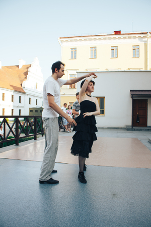 MINSK, BELARUS.August 12, 2017 Couples dancing outdoors on the streetのeditorial素材
