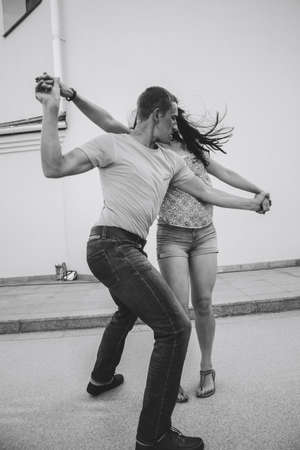 MINSK, BELARUS.August 12, 2017 Couples dancing outdoors on the street