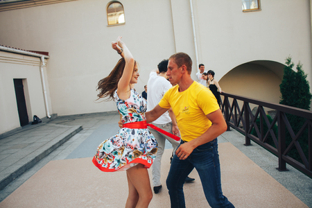 MINSK, BELARUS.August 12, 2017 Couples dancing outdoors on the streetのeditorial素材