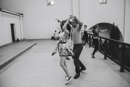 MINSK, BELARUS.August 12, 2017 Couples dancing outdoors on the streetのeditorial素材