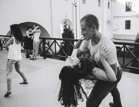 MINSK, BELARUS.August 12, 2017 Couples dancing outdoors on the streetのeditorial素材