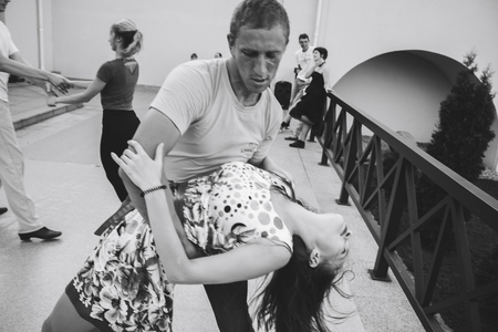 MINSK, BELARUS.August 12, 2017 Couples dancing outdoors on the streetのeditorial素材