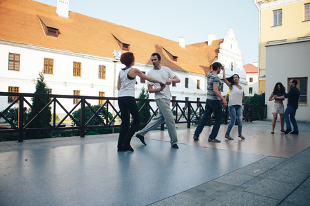 MINSK, BELARUS.August 12, 2017 Couples dancing outdoors on the streetのeditorial素材