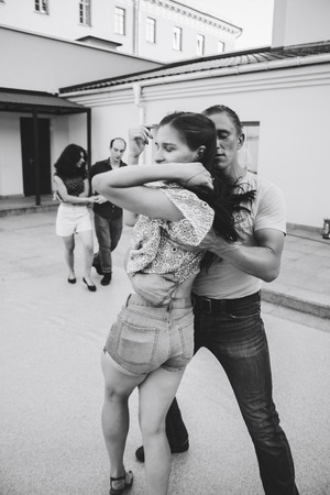 MINSK, BELARUS.August 12, 2017 Couples dancing outdoors on the streetのeditorial素材