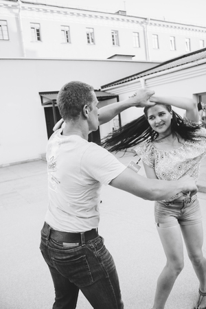 MINSK, BELARUS.August 12, 2017 Couples dancing outdoors on the streetのeditorial素材