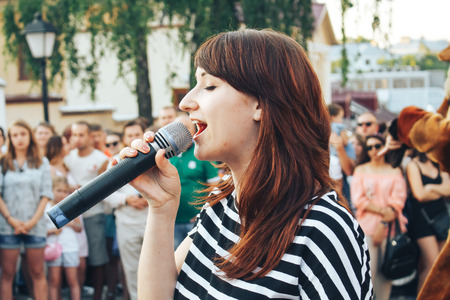 MINSK, BELARUS.August 19 2017 Woman singing on the streetのeditorial素材