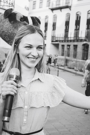 MINSK, BELARUS.August 19 2017 Woman singing on the streetのeditorial素材