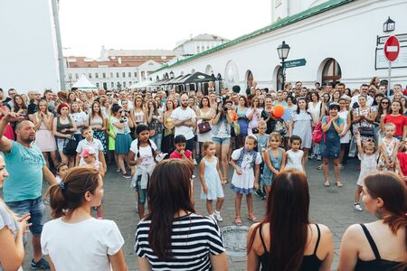MINSK, BELARUS.August 19, 2017. Group of people laughing and posing in front of camera