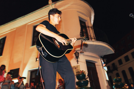 MINSK, BELARUS.August 19, 2017. A man with a guitar sings on the streetのeditorial素材