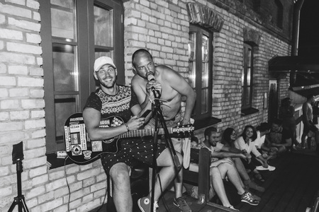 MINSK, BELARUS.August 19, 2017. A man with a guitar sings on the streetのeditorial素材