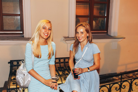 MINSK, BELARUS.August 19, 2017 Two friends are standing on the streetのeditorial素材