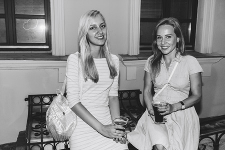 MINSK, BELARUS.August 19, 2017 Two friends are standing on the streetのeditorial素材