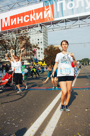 MINSK, BELARUS.September 10 2017 Minsk half-marathon 2017 The girl poses in front of the cameraのeditorial素材