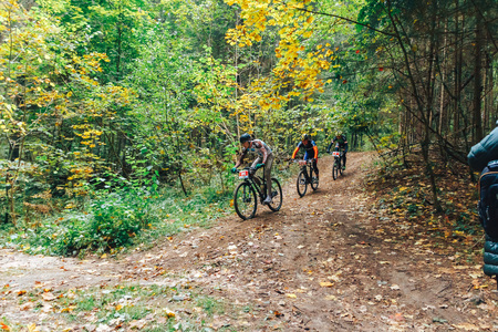 Minsk region Kryzhovka October 8, 2017 Bike ride A group of people riding bicycles in the forestのeditorial素材