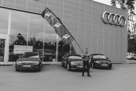 MINSK, BELARUS.August 26, 2017. Test drive audi. A man is showing a flagのeditorial素材