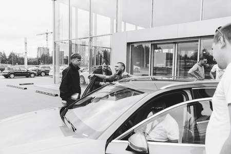 MINSK, BELARUS.August 26, 2017. Test drive audi. A group of people talking on the streetのeditorial素材