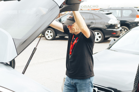 MINSK, BELARUS.August 26, 2017. Test drive audi. A man looks under the hood of a carのeditorial素材