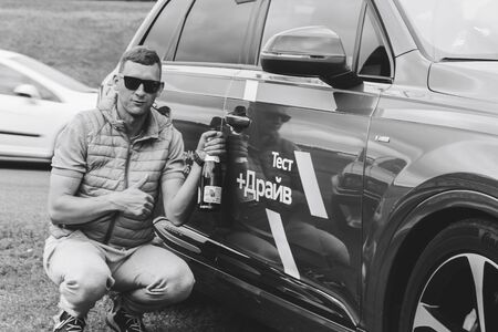 MINSK, BELARUS.August 26, 2017. Test drive audi. A man is sitting by the carのeditorial素材